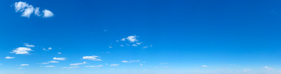 Blue Sky background with tiny Clouds. Panorama background