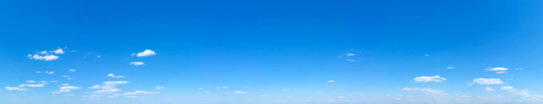 Blue Sky background with tiny Clouds. Panorama background