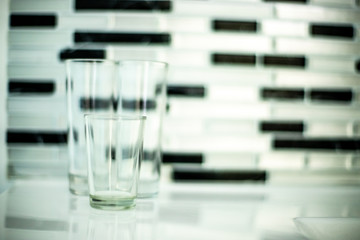 abstract shot of glasses in black and white wall background