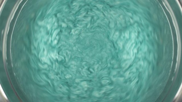 Rheoscopic fluid. Beautiful movement of particles in a liquid. Fantastic patterns and shapes.