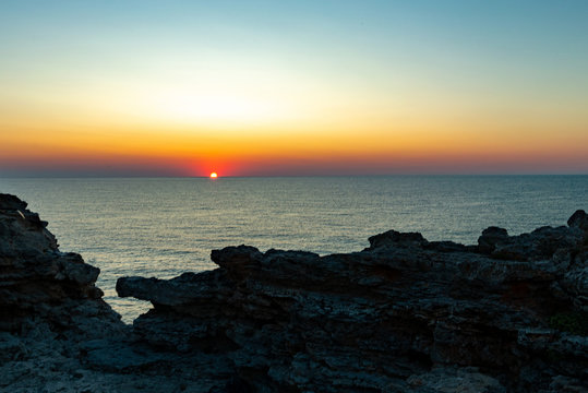 sunrise from the cliffs of the ocean © florinfaur
