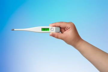 Chilld hand with thermometer with high temperature 39.5 on the blue background