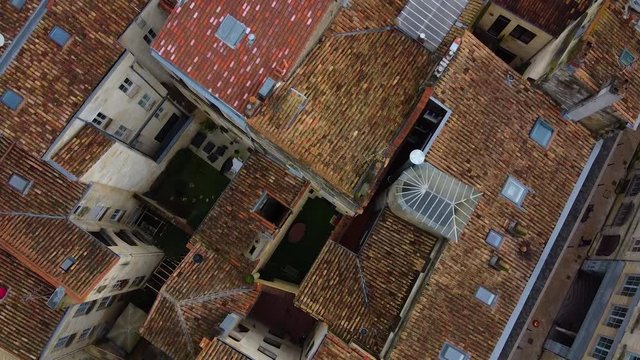 Drone footage over Bordeaux city on a sunny day, footage include old building and people are enjoying walking.