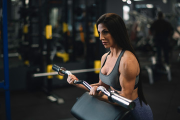 Fototapeta premium Fitness woman on training. Young woman in the gym. 