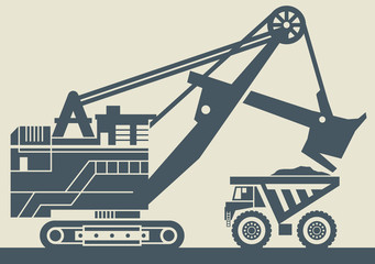 Ore loading with a powerful excavator. Loading a large mining truck © Flavijus Piliponis