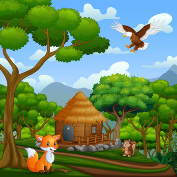 A wooden cottage and animals in the middle of forest