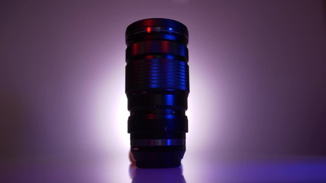 Moody red and blue light swipe of mirrorless telephoto camera lens