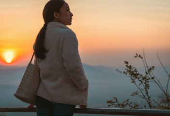 tourist women in white Winter coat and jeanes in relaxing Emotional The winter with blur background...