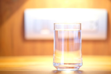 Close up glass of water on counter background and space for text 