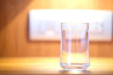 Close up glass of water on counter background and space for text 