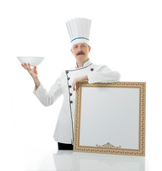 Chef cook holds blank board to fill the menu and empty plate. Place for text. Restaurant or cafe menu