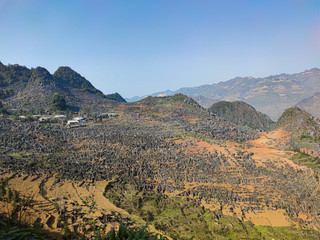 Fototapeta na wymiar Big valley with black rocks. View from the top.