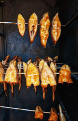 Halibut fish freshly smoked in a smoker. Hippoglossus hippoglossus.