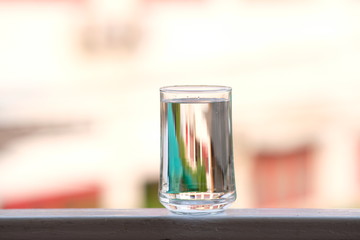 Water in glass on counter background and space for text 