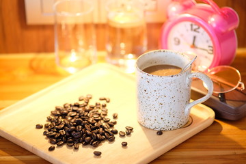 Coffee cup on wooden background and space for text 