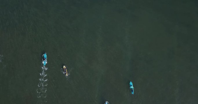 Aerial view of surfers at Balangan beach, Bali, Indonesia