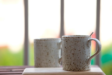 Coffee cup on wooden background and space for text 