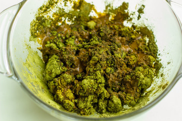 Pile of dry henna powder isolated on white.