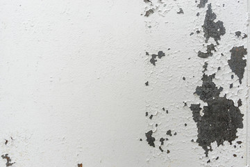 Old rusty steel surface closeup, metal wall with cracked weathered white paint. Abstract grunge texture as background for your design with copy space and place for text