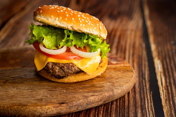 homemade hamburger on a wooden board. 