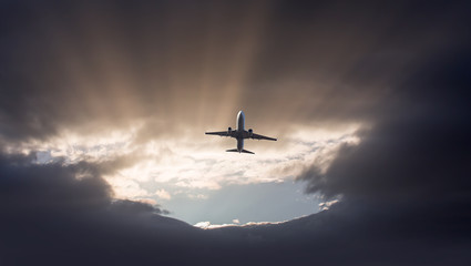 A passenger plane flying in a stormy sky and landing the storm