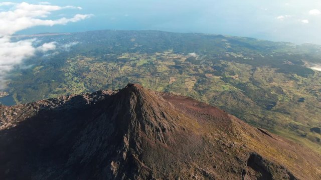 Aerial view of Mount Pico volcano in the Azores. The highest mountain in Portugal can be seen towering above sea level.