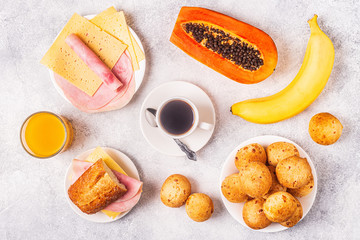 Traditional Brazilian breakfast - cheese bread, coffee, ripe fruit.