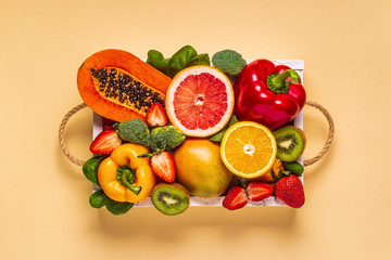 Fruits and vegetables rich in vitamin C in box. Healthy eating.