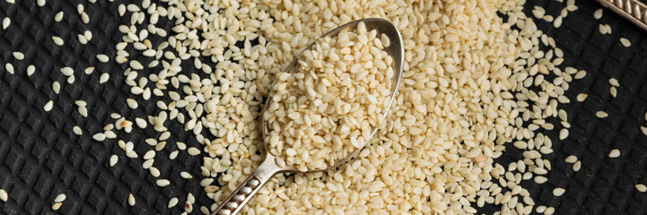 Close up view of dry sesame seeds. Natural oil-rich food