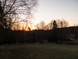Naklejka premium colorful sunset in a countryside landscape