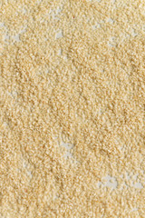 Close up view of dry sesame seeds on white background. Natural oil-rich food