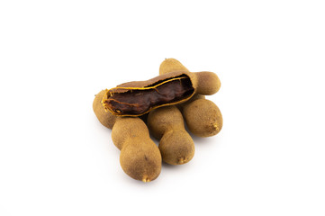 Fresh whole tamarind fruits on white background