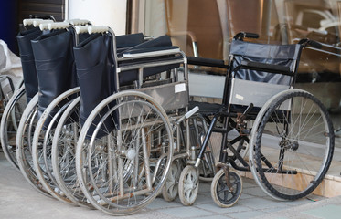 Fototapeta na wymiar Closeup of used wheelchairs.
