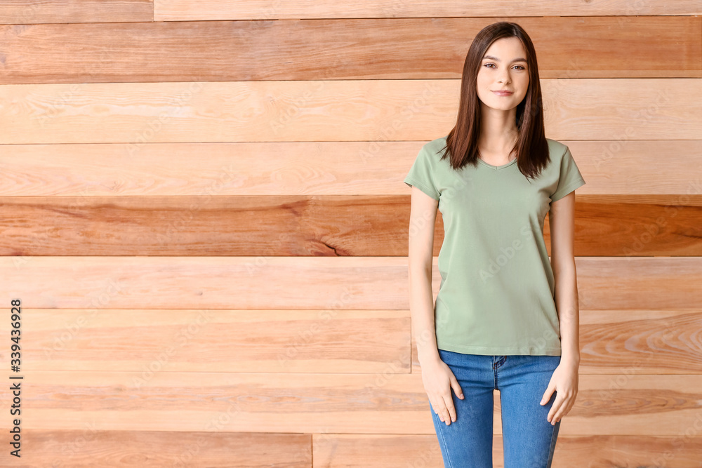 Canvas Prints woman in stylish t-shirt on wooden background