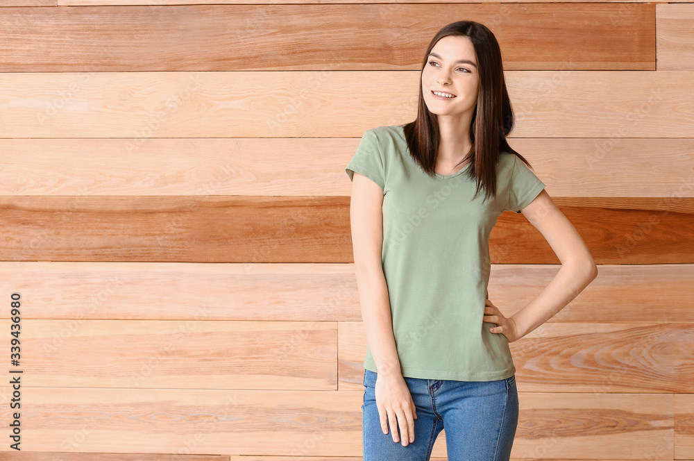 Poster Woman in stylish t-shirt on wooden background