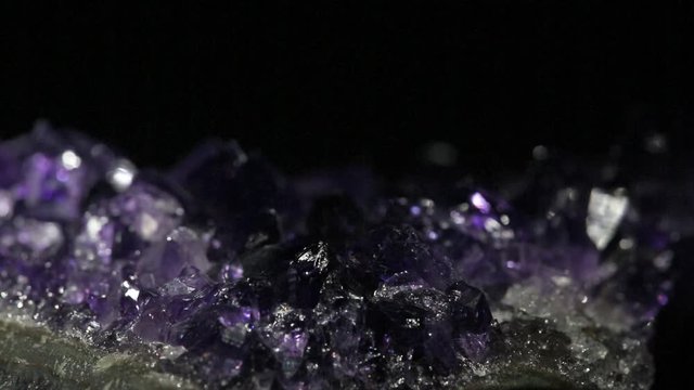 video with light in small lilac amethyst crystals