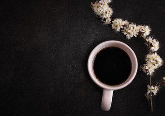 Ceramic cup with coffee on a dark background