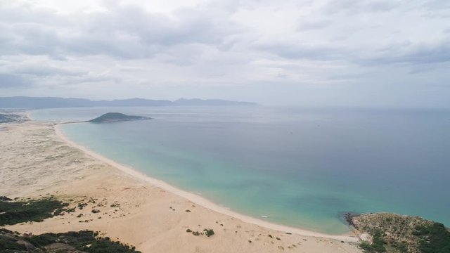 Aerial of Hon Ngang Beach at Dam Mon Peninsula, Van Phong Bay, Van Ninh, Khanh Hoa. 80km north of Nha Trang, is beautiful with its 10km untouched wilderness white sandy beach and crystal clear water