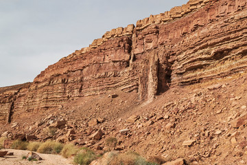geological detail of the cliff next to wadi ardon in the makhtesh ramon crater showing two magma...