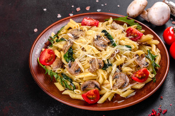 Pasta with mushrooms, cheese, spinach, rukkola and cherry tomatoes