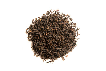 Heap of dried black tea leaves isolated on white background. Everyday brew loose tea made with whole leaves. Top view