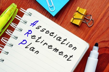 The photo shows Association Retirement Plan. Notepad, heap, marker.