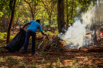 man with fire extinguisher in forest