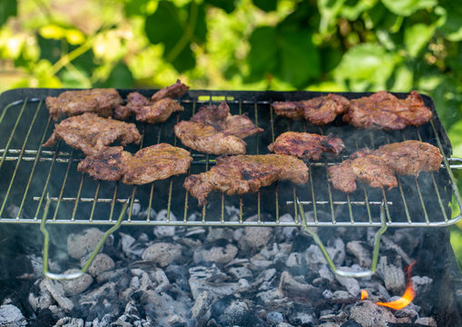 Unhealthy but tasty grilled sausages and meat
