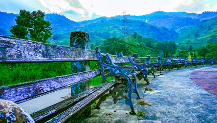 Mountain landscape with wooden benches