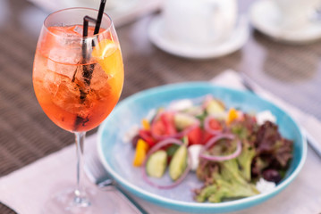 salad with a light aperitif in a glass with ice