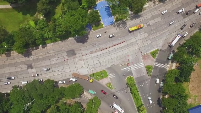 Elliptical road with vehicles and trees
