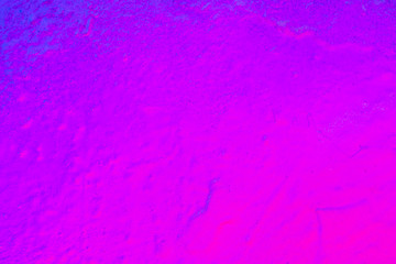 Beautiful bright colorful street art graffiti background. Abstract creative spray drawing fashion colors on the walls of the city. Urban Culture, black ,blue, purple , violet , neon texture