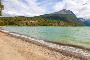 Ushuaia. Argentina. Tierra Del Fuego National Park. Lake Acigami (Lago Acigami).
 The view of the lake surrounded by mountains is a harsh beauty. 