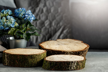 Wooden trays on a wooden table on a holiday day with free space for an advertising product